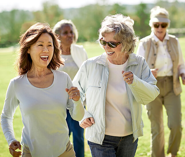 A group of older women walking together.